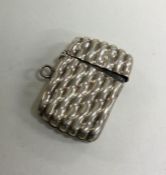 A silver reeded vesta case. Birmingham. Approx. 12