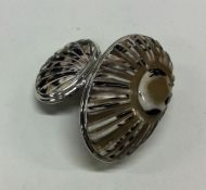 An 18th Century silver mounted cowrie shell snuff