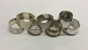 A bag containing various silver napkin rings. Appr