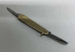 A heavy 9 carat double sided flick knife. Approx.