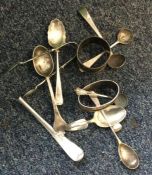 A bag containing silver spoons, napkin rings etc.