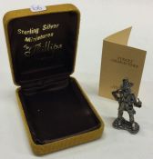 A cased silver figure of a watchman, complete with