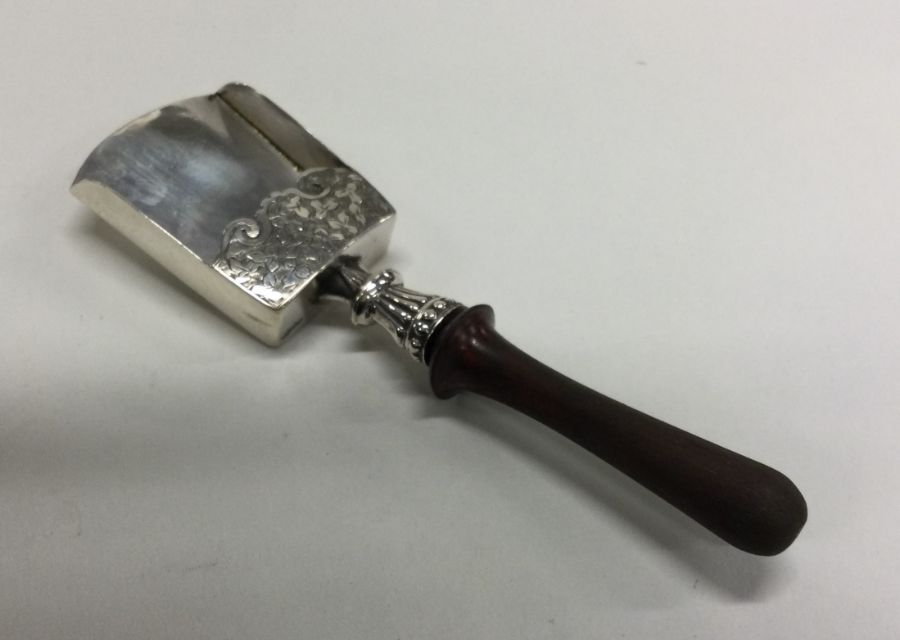 A heavy Georgian style silver caddy scoop with eng
