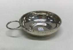 A Continental silver wine taster. Approx. 33 grams