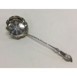 A small silver engraved sifter spoon. Birmingham.