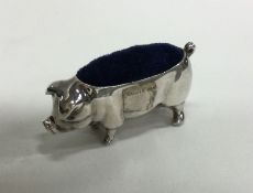 A silver pin cushion in the form of a pig. Approx.