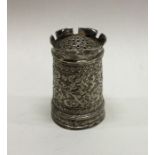 A heavy Indian chased silver pepper grinder. Approx. 80 g