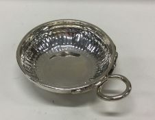 A heavy mid-18th Century French silver wine taster