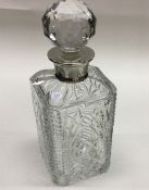 A large heavy cut glass silver mounted decanter. L