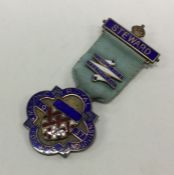 OF ROYAL INTEREST: A silver and enamelled medal. L