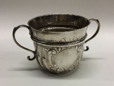 A George I fluted porringer. London 1716. By Seth