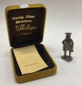 A cased silver figure of a man, complete with orig