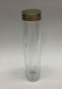 A large silver gilt and glass bottle. London 1938.