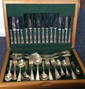 A box containing a silver plated cutlery service.
