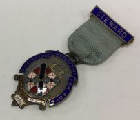 OF ROYAL INTEREST: A silver and enamelled medal. L