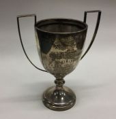 An Edwardian silver two handled trophy cup. Approx