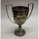 An Edwardian silver two handled trophy cup. Approx