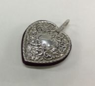 An English silver chased heart pin cushion. Approx