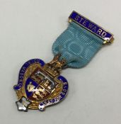 OF ROYAL INTEREST: A silver and enamelled medal. B