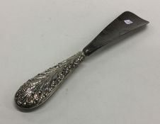 A heavy silver handled shoe horn. London 1907. App