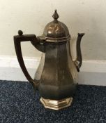 A heavy shaped silver coffee pot. London. By TH. A