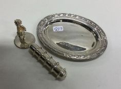 A small oval silver pin dish together with a needl