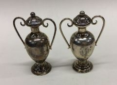A pair of silver peppers in the form of trophy cup