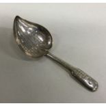 A silver leaf shaped caddy spoon with basket weave