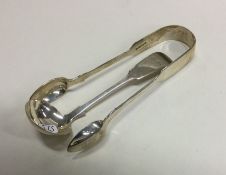 EXETER: A small silver cream ladle together with a