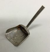 A silver shovel shaped caddy spoon. Birmingham 181