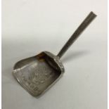 A silver shovel shaped caddy spoon. Birmingham 181