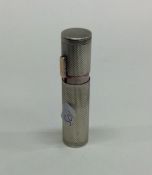 An unusual heavy silver and gold mounted lipstick