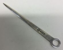 A heavy silver letter opener. Approx. 56 grams. Es