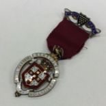 OF ROYAL INTEREST: A silver and enamelled medal. L