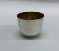 An unusual Antique silver tumbler cup with gilt in
