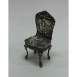A miniature chased silver chair. Birmingham 1901.