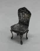 A miniature chased silver chair. Birmingham 1901.