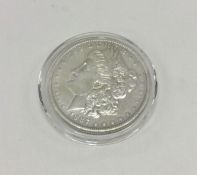 A silver 1oz American dollar. Approx. 30 grams. Es