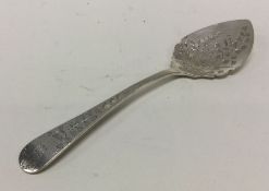 A Victorian silver engraved spoon. Sheffield 1897.