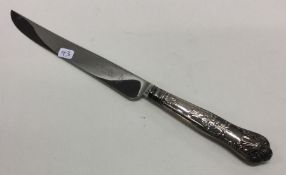 A silver bread knife. Approx. 56 grams. Est. £20 -