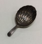 A Georgian silver fluted caddy spoon with bright c