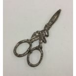 A novelty pair of silver grape scissors in the for