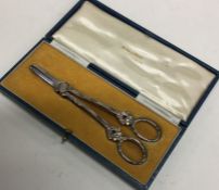 A cased pair of silver grape scissors. Sheffield.