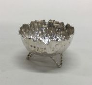 An Art Nouveau silver salt with bark effect decora