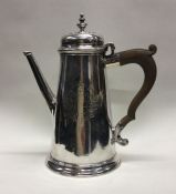 A fine George II silver coffee pot of tapering for
