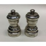 A good pair of silver pepper grinders. London. By