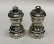 A good pair of silver pepper grinders. London. By