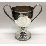 A good large Georgian silver trophy cup with reede