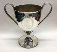 A good large Georgian silver trophy cup with reede
