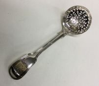 A silver fiddle and thread crested ladle. London 1